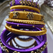 Silk-wrapped kundan bangles in purple and gold