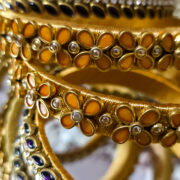 Gold-tone bangles with purple kundan stones