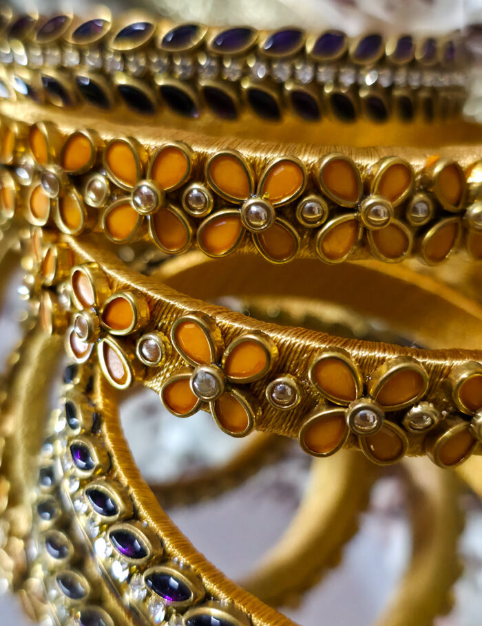 20250924_223900 Gold-tone bangles with purple kundan stones