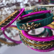 Silk-wrapped bangles in green and pink thread