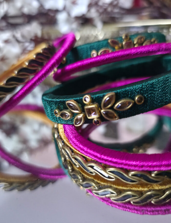 Silk-wrapped bangles in green and pink thread