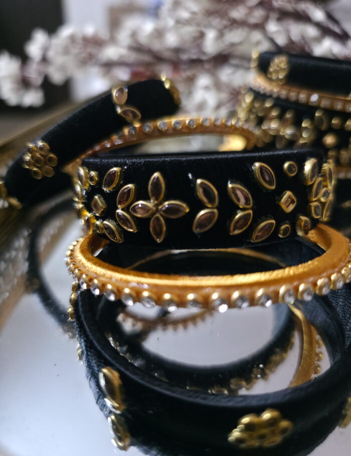 20251002_233958 Silk-wrapped kundan bangles in black and beige