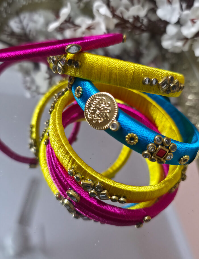 20251002_234333 Blue and yellow silk thread bangles set