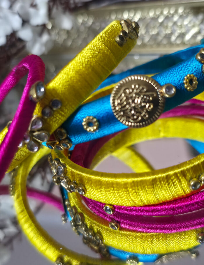 20251002_234337 Silk thread bangles in blue and yellow
