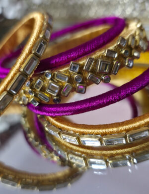 Gold and magenta silk thread kundan bangles set