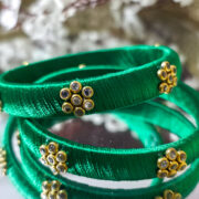 Pair of green silk-wrapped thread bangles