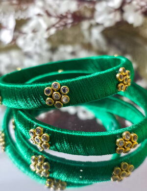 20251003_000600 Pair of green silk-wrapped thread bangles
