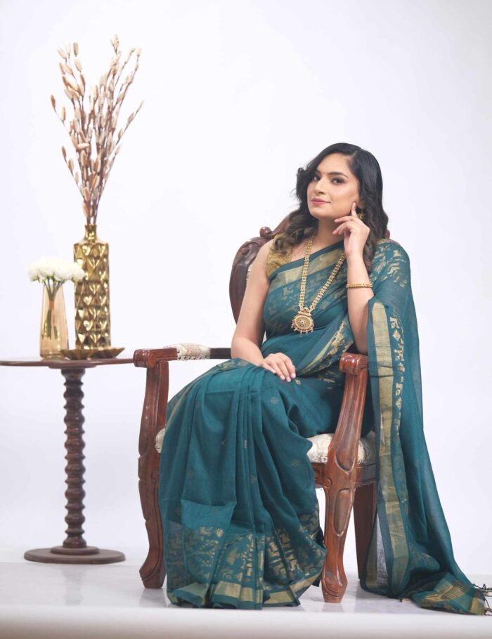 Teal khadi saree, shimmering zari edge