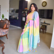 Elegant pastel linen saree with zari accents