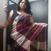 Brown linen saree featuring shimmering zari works