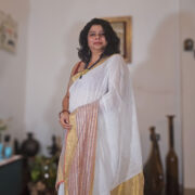 Soft linen saree in mogra color trimmed with zari