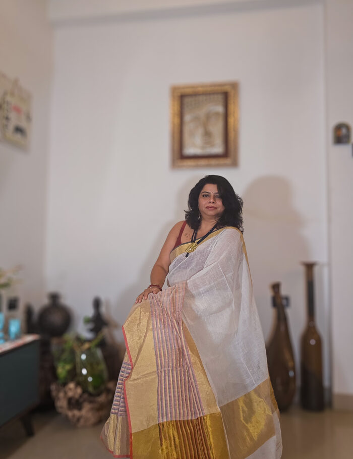 20250811_203450 Mogra-toned linen saree finished with a gold zari border