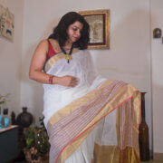 Handwoven mogra linen saree featuring a zari border