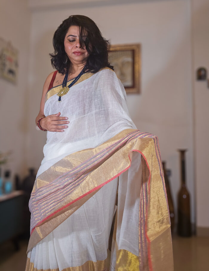 20250811_203609 Elegant linen saree in mogra shade with metallic zari edge