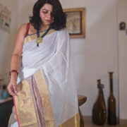 Soft cream linen saree with gold zari trim