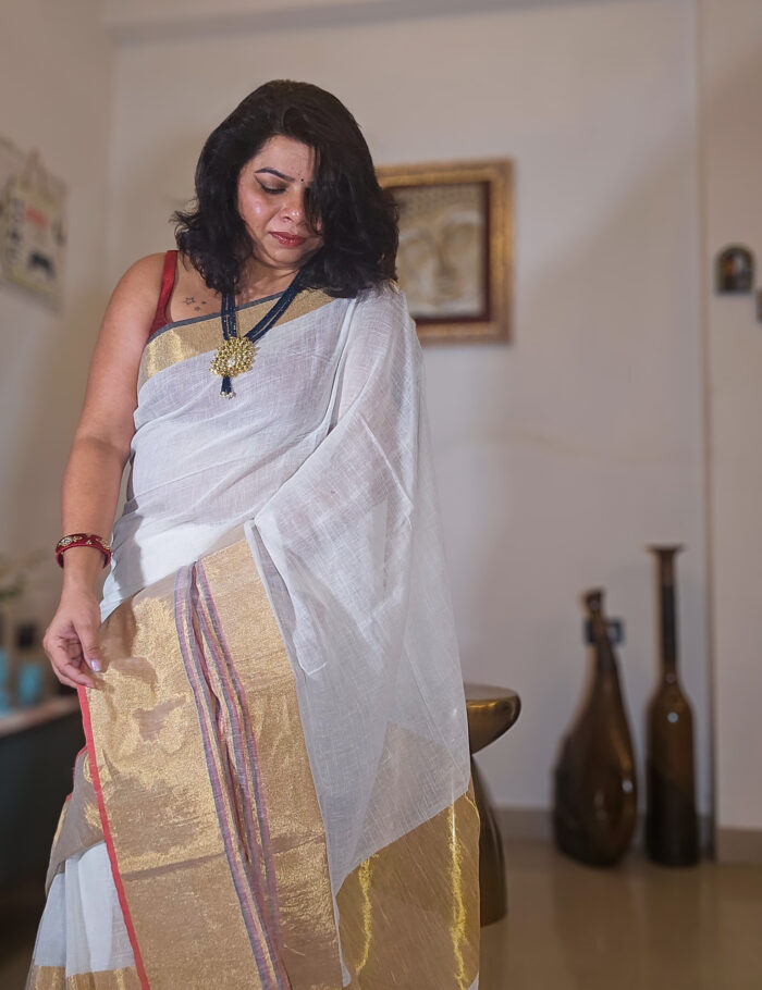 20250811_203618 Soft cream linen saree with gold zari trim