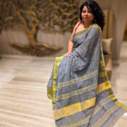 Linen saree in muted saleti shade with decorative zari border