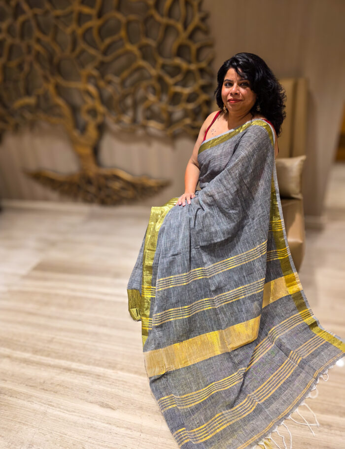 20250820_205659 Linen saree in muted saleti shade with decorative zari border
