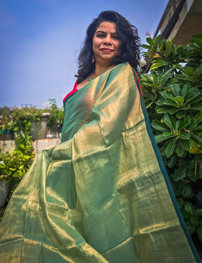 20250828_135938 Green tissue saree showcased in natural light