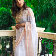 Minimalist white cotton saree enhanced with zari border