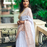Pure white khadi cotton saree with ornate zari border