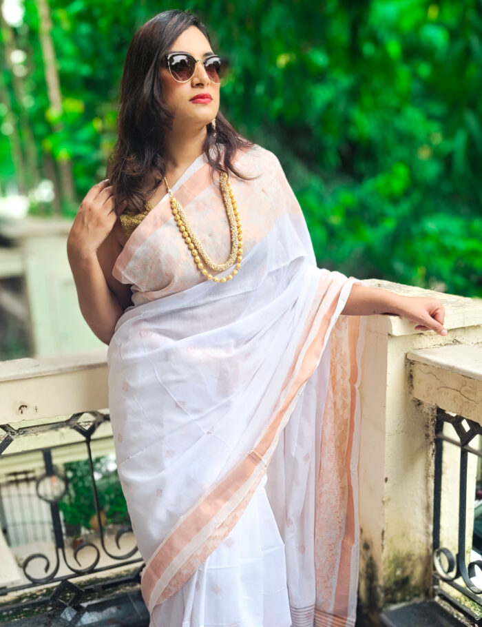 20250830_110633 White handloom cotton saree featuring zari border