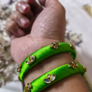 Two light-green silk-wrapped kundan bangles