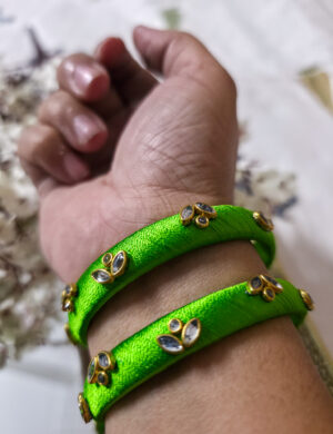 20250923_203700 Two light-green silk-wrapped kundan bangles