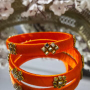 Two-piece orange silk-thread kundan bangle set