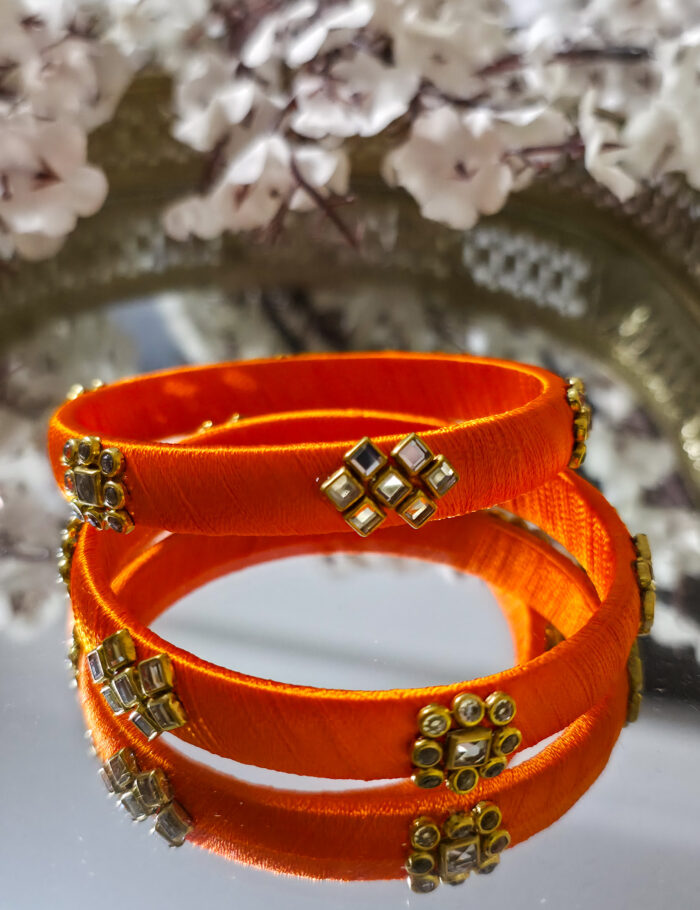 Two-piece orange silk-thread kundan bangle set