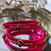 Two pink silk-wrapped kundan bangles