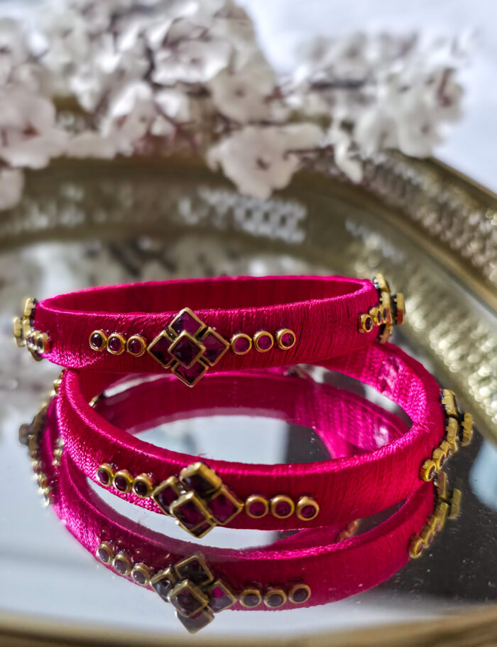 20250923_210827 Two pink silk-wrapped kundan bangles