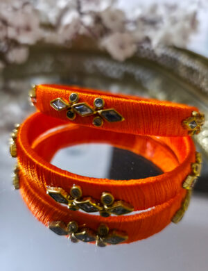 20250923_211204 Orange silk-thread kundan bangle pair