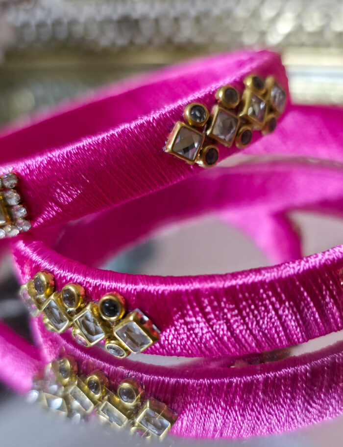 20250923_211535 Glossy pink silk-thread bangles with square kundan embellishments