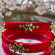 Two silk-wrapped kundan bangles in mint green