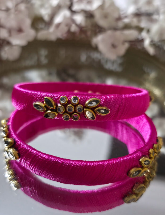 20250923_212053 Pink silk-thread bangles with golden kundan stone detailing