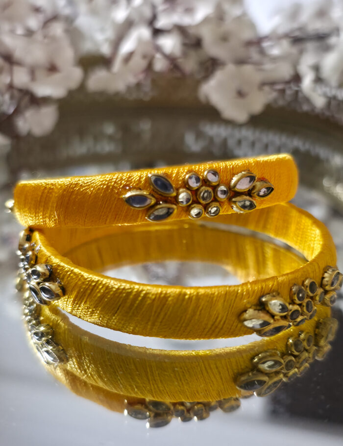 20250923_212214 Pair of yellow silk-thread bangles with kundan work