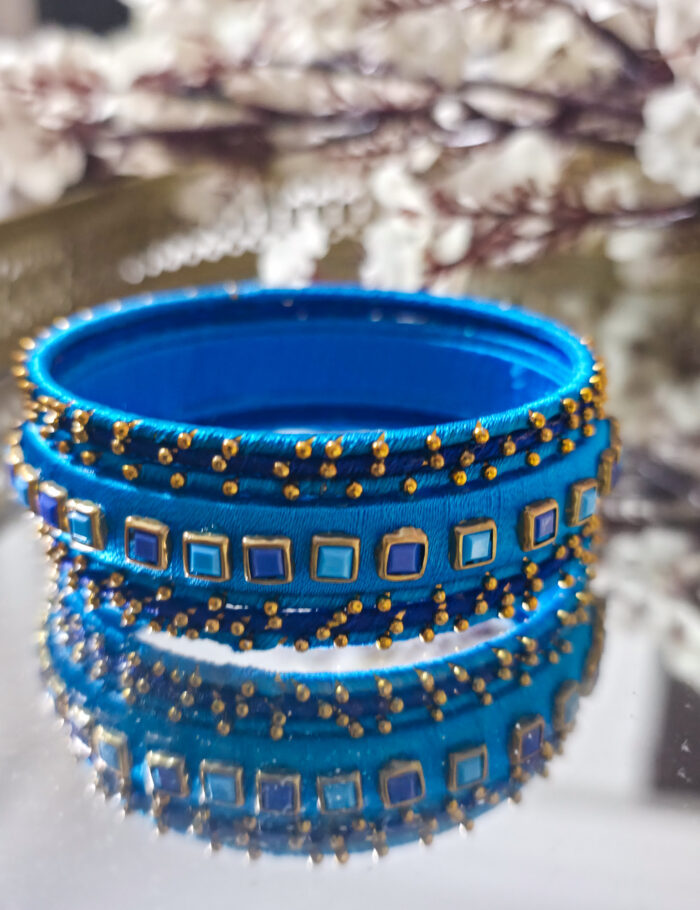 Silk-wrapped bangles in navy and sky blue, set of 7