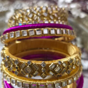 Gold and magenta silk-thread kundan bangle set