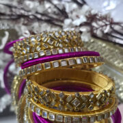 Gold and magenta silk-thread kundan bangle set