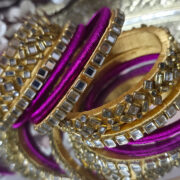 Gold and magenta silk-thread kundan bangle set
