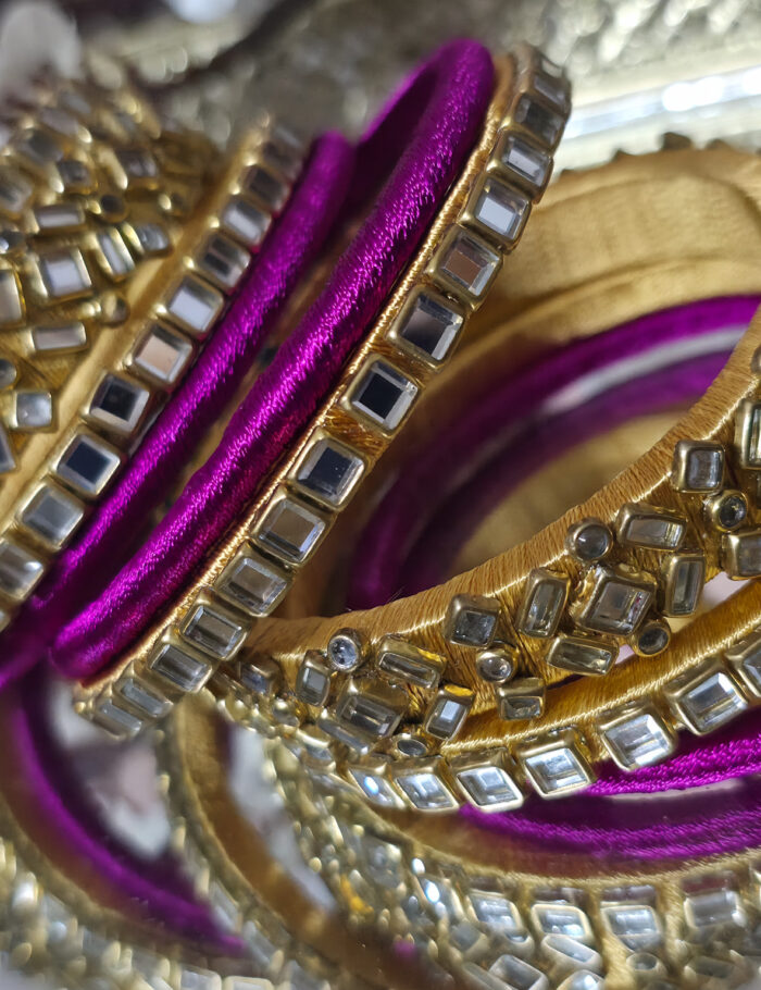 20250927_222916 Gold and magenta silk-thread kundan bangle set