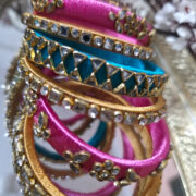 Silk-wrapped kundan bangles in pink and turquoise
