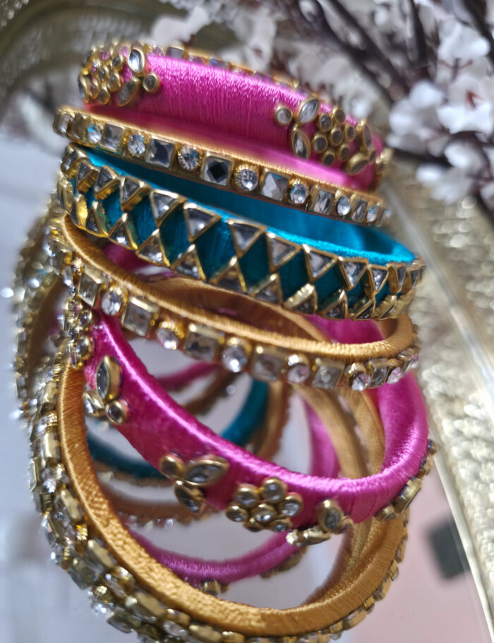 Silk-wrapped kundan bangles in pink and turquoise