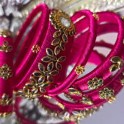 Silk-wrapped kundan bangles in bright pink