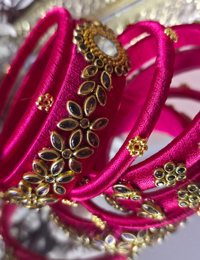 Silk-wrapped kundan bangles in bright pink