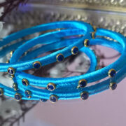 Handcrafted duo of silk-thread kundan bracelets