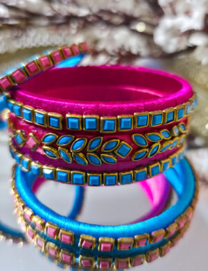 20250927_230205 Silk-wrapped kundan bangles in blue and pink