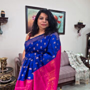Blue cotton saree featuring pink pallu and zari trim