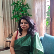 Green silk saree woven in Katan fabric with subtle sheen